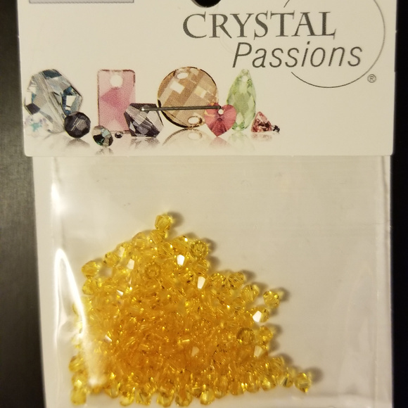 4/$75 Swarovski 3mm Bi-cone Light Topaz Crystals - Picture 1 of 3